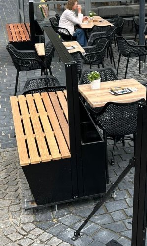 Wind protection with height-adjustable window box and bench