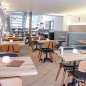 Preview: Stuhl "Studo" aus bordeaux rotem Kunstleder und Gestell aus Eiche und Stahl