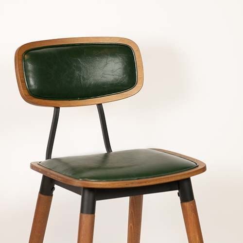 "Studo" bar stool made of green synthetic leather and frame made of oak and metal
