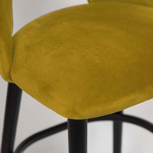 "Jyll" bar stool made of yellow gold velvet and legs made of black solid beech