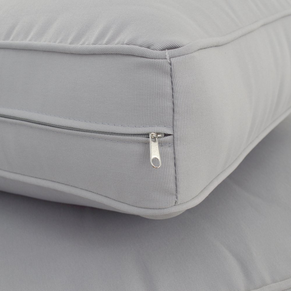 Corner sofa with large fabric cushions in gray